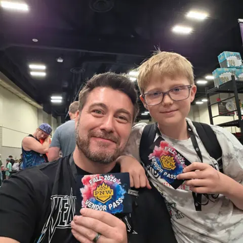 Dan sharing a card-show moment with a young collector