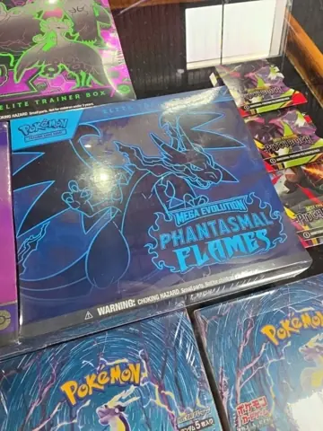 Pokémon Phantasmal Flames box among trading-card collectibles